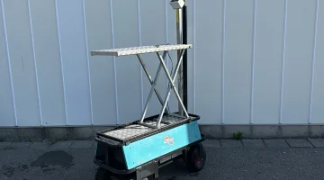 Berg electro transport trolley on pneumatic tires with mechanical scissor.