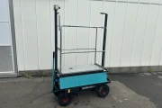 Berg electro transport trolley on pneumatic tires with mechanical scissor.