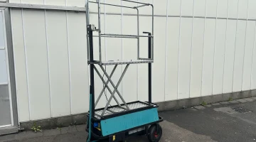 Berg electro transport trolley on pneumatic tires with mechanical scissor.