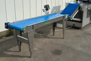 Christiaens Feeding conveyor elevator for cucumber sealer