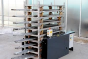 Devette destacking machine for Danish trolleys