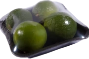 Pears and limes on a foodtainer with strech film