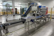 Newtec PCS2009 weigher with Ilapak Carrera 500 flowpack machine for trays