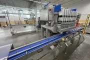 Newtec PCS2009 weigher with Ilapak Carrera 500 flowpack machine for trays