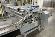 Newtec PCS2009 weigher with Ilapak Carrera 500 flowpack machine for trays