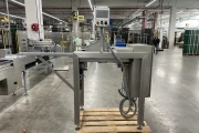 Newtec PCS2009 weigher with Ilapak Carrera 500 flowpack machine for trays
