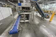 Newtec PCS2009 weigher with Ilapak Carrera 500 flowpack machine for trays