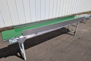 Wind barriers for potted plant conveyors